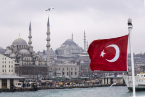 Turkey, Istanbul, Eminoenue, View Harbour, Yeni Camii and Turkish Flag